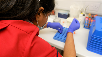 A research worker conducting testing.