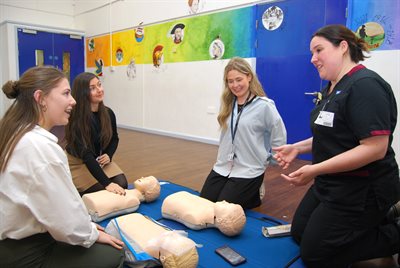 MR1658 Tanya Birke teaches resuscitation to Harriet Smith Georgie Robinson and Daisy Gibbins