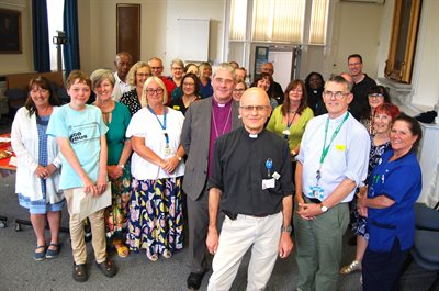 MR1615 NGH Hospital Chaplain George Sarmezey retires pictured with the Bishop of Brixworth the Rt Rev John Holbrook and the Rev Mike Corcoran July 30 2025.docx